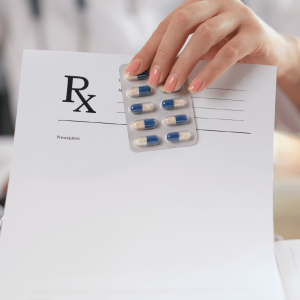 medical-doctor-holds-blister-pills-writes-prescription-patient-closeup-life-saving-insurance-prescribe-treatment-with-legal-pharmacy-concept