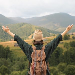young-female-traveler-enjoying-rural-surroundings